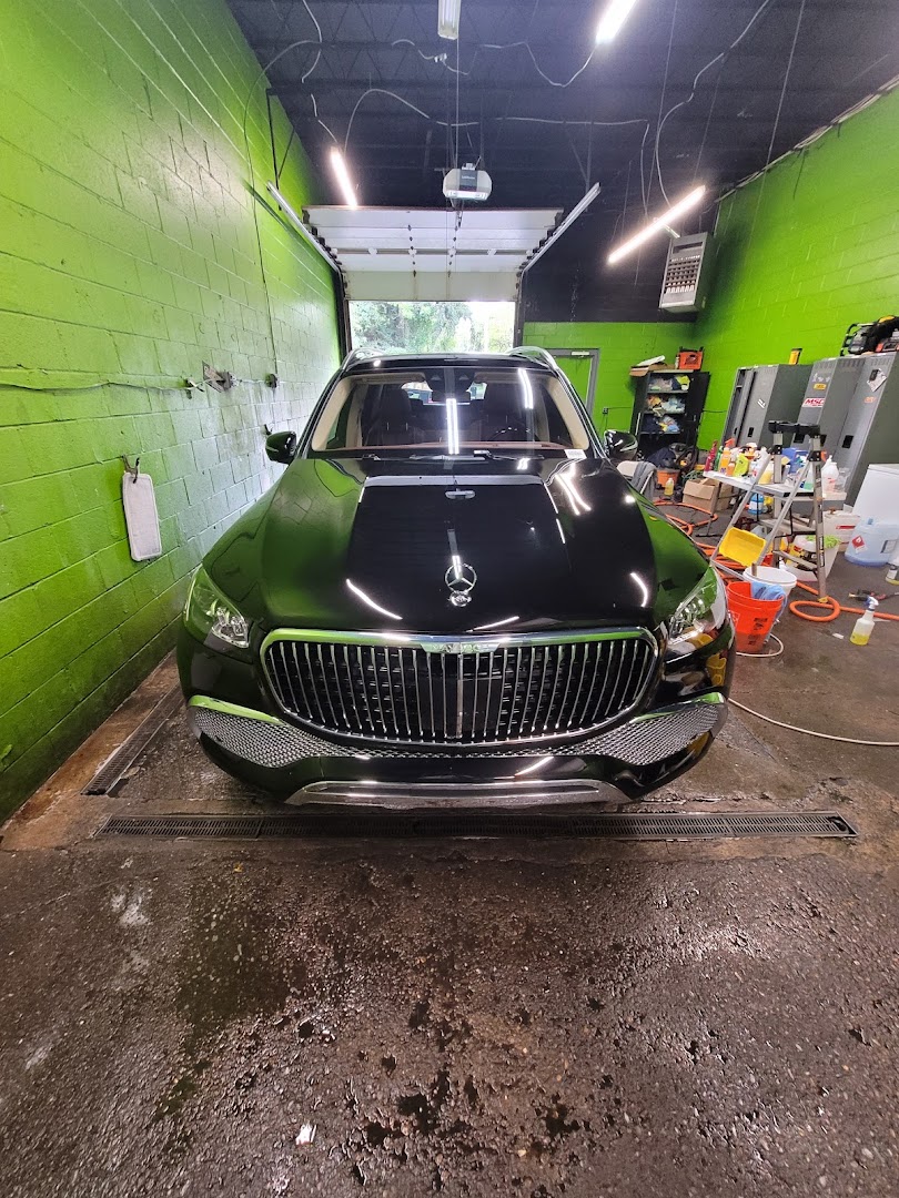 Gleaming black Mercedes-Maybach GLS after hand detail in the wash bay