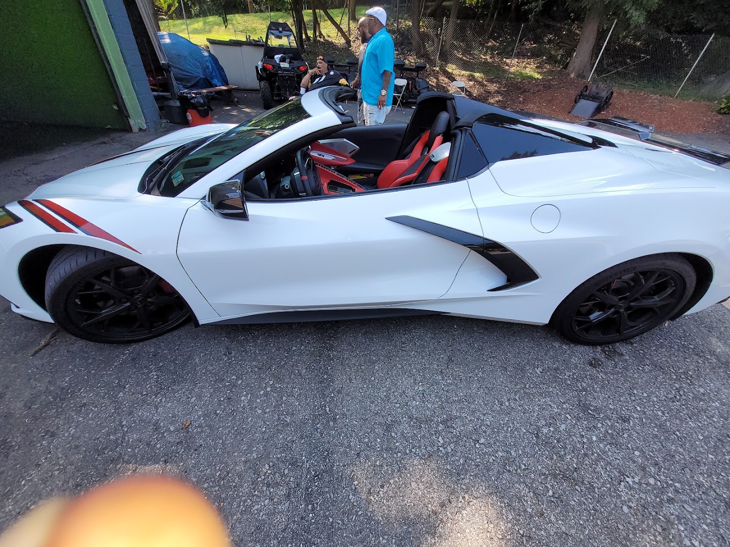 White Corvette C8 convertible after hand car wash service